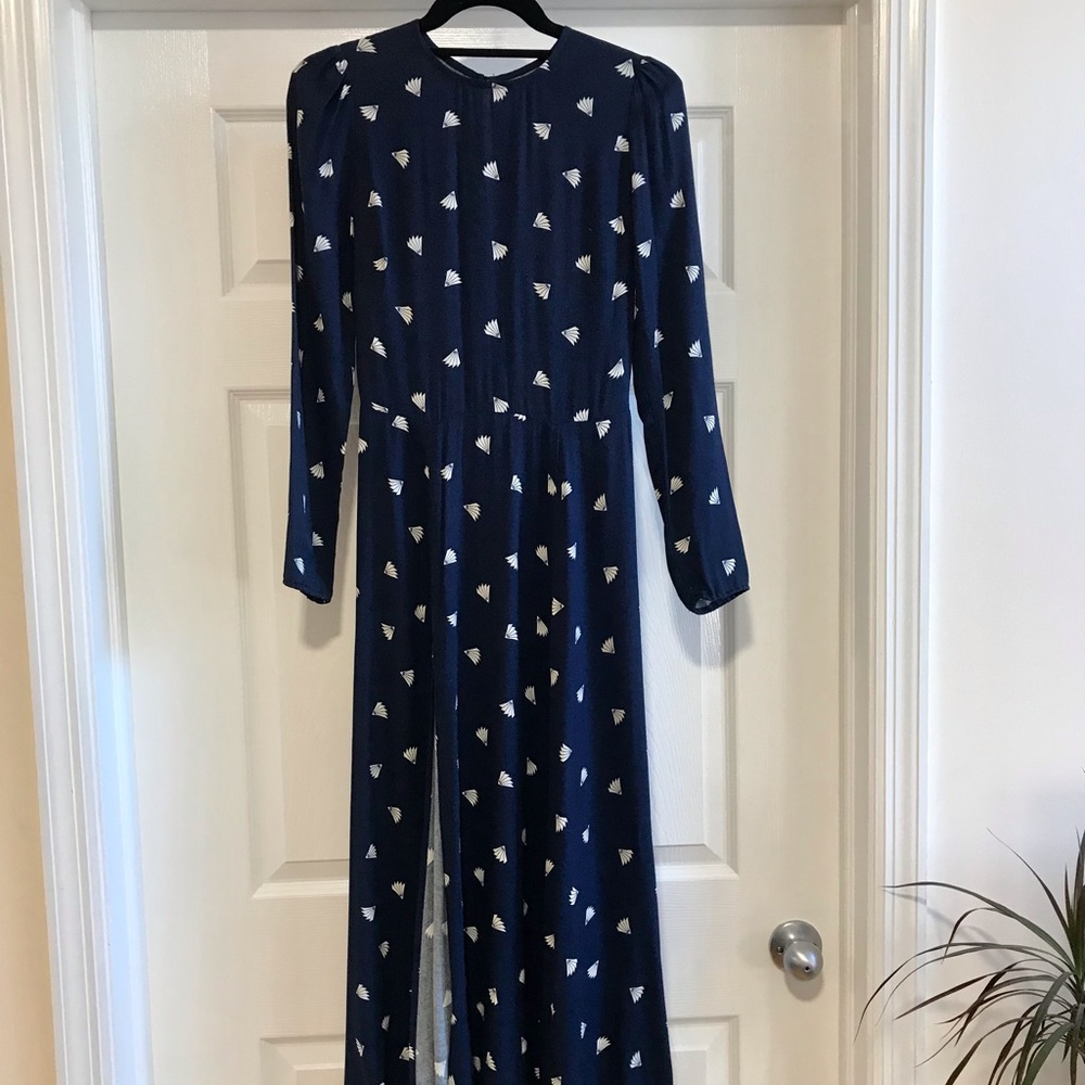 Reformation t-length blue long sleeved patterned dress wit high slit.